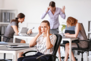 woman surrounded in office with noisy surroundings
